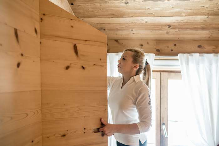 A woman does the cleaning in the room