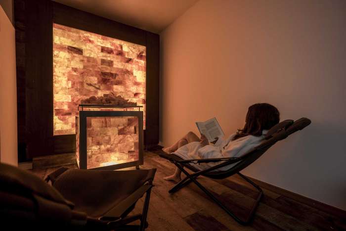 Girl reading and relaxing in front of the salt wall